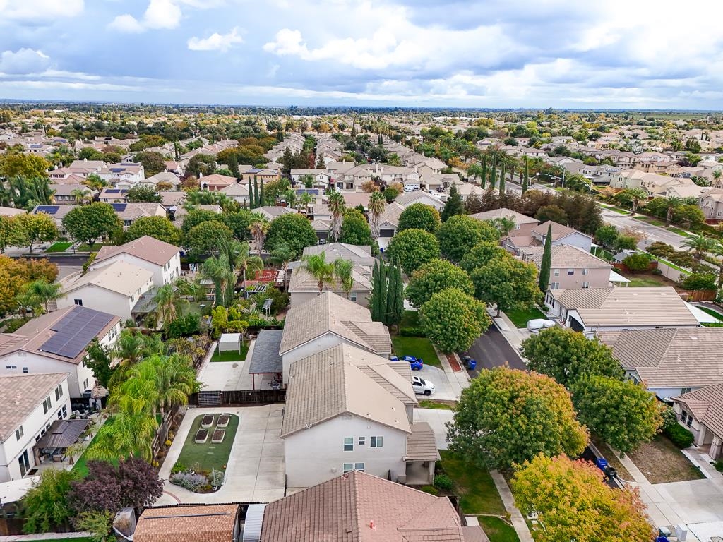 1413 Angus Street Patterson, CA 95363 - Photo 52 of 60 an aerial view of residential houses with outdoor space