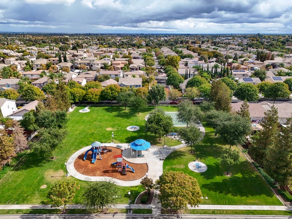 1413 Angus Street Patterson, CA 95363 - Photo 55 of 60 an aerial view of residential houses with outdoor space and trees