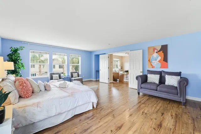 a bedroom with a bed and a couch