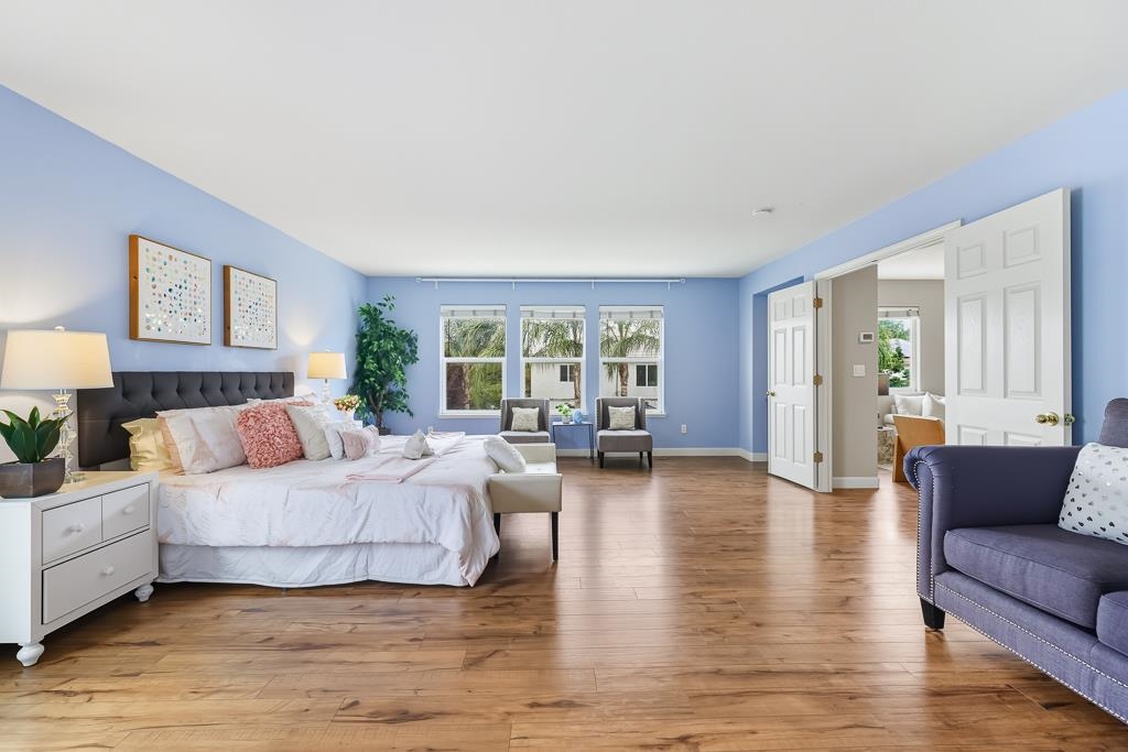 1413 Angus Street Patterson, CA 95363 - Photo 10 of 60 a bedroom with furniture and wooden floor