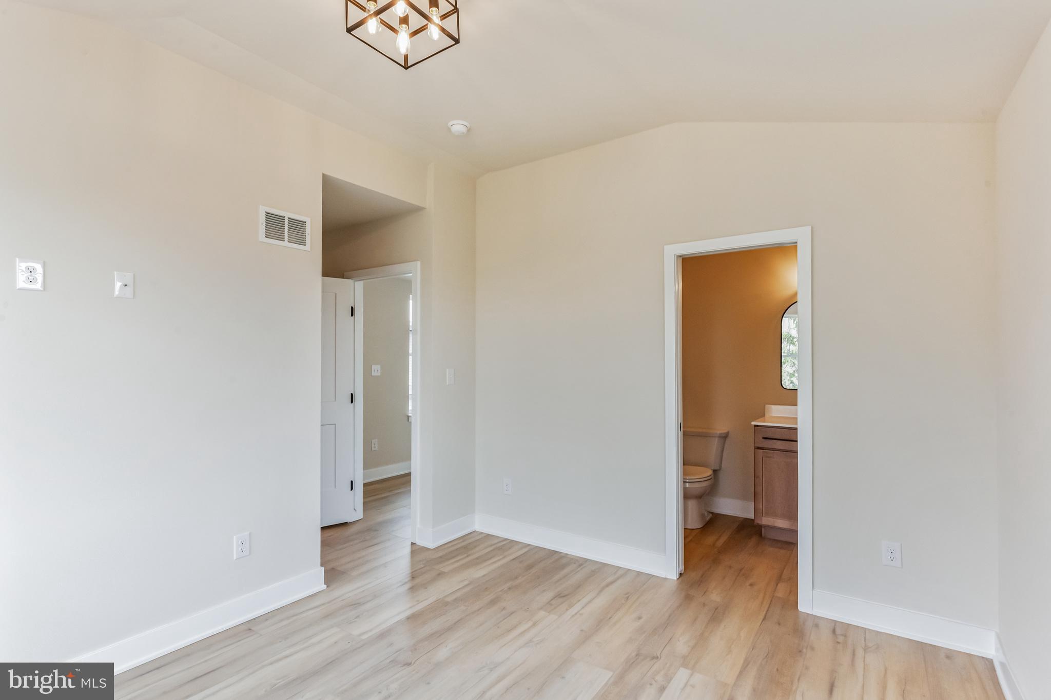 1236 Butler Pike, Unit 2 Conshohocken, PA 19428 - Photo 11 of 15 a view of a room with wooden floor and a hallway