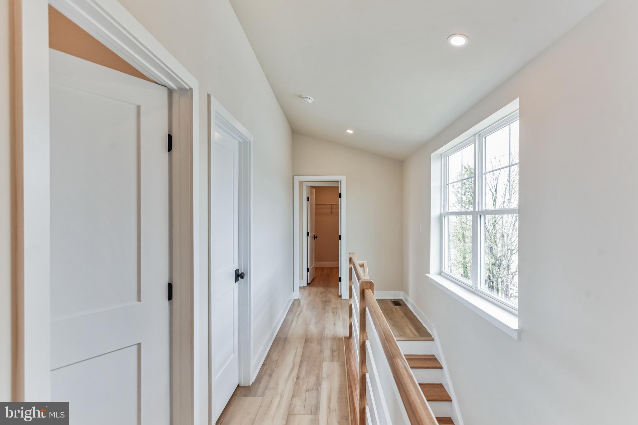 1236 Butler Pike, Unit 2 Conshohocken, PA 19428 - Photo 12 of 15 a view of a hallway with wooden floor and windows