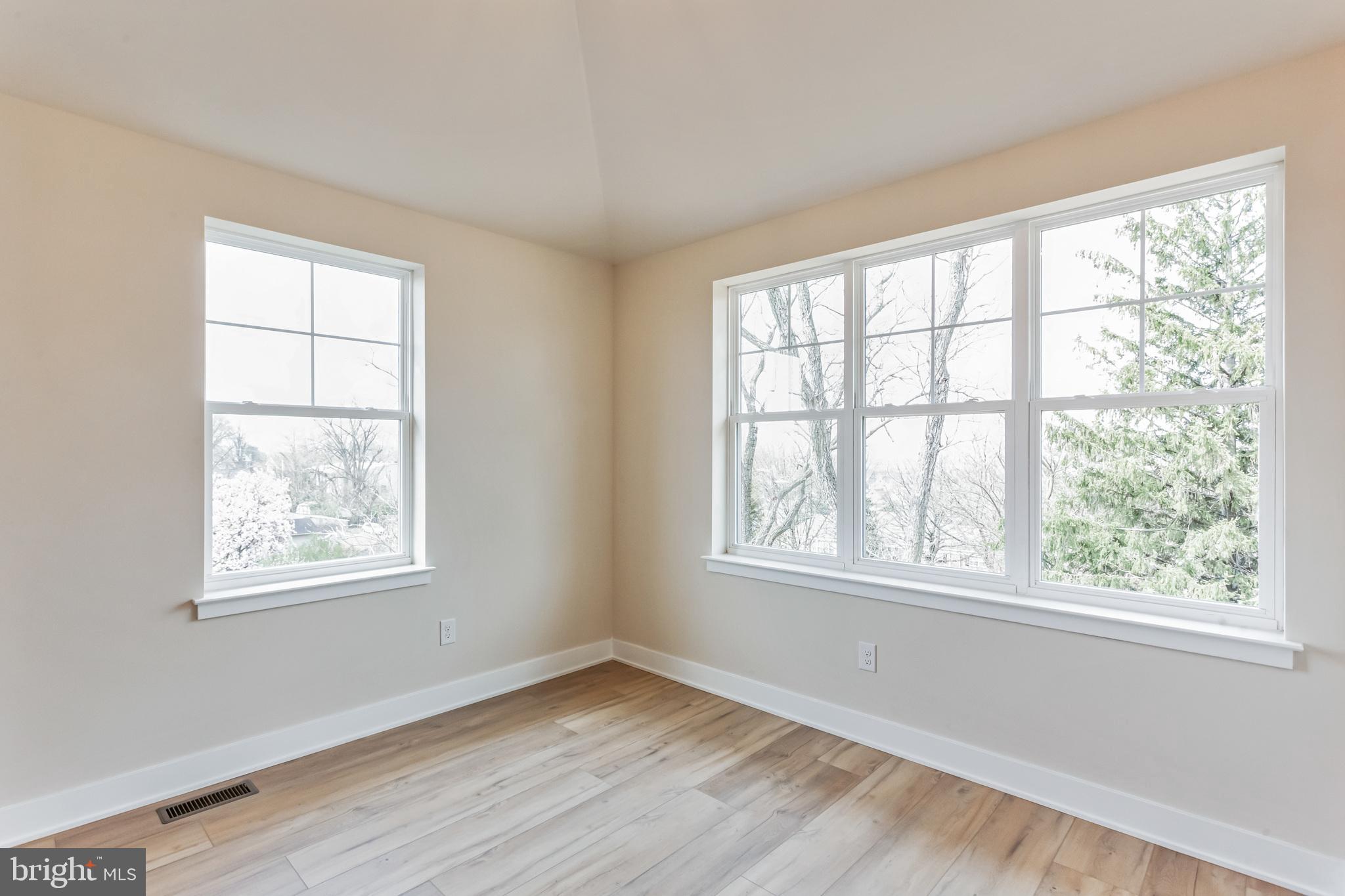 1236 Butler Pike, Unit 2 Conshohocken, PA 19428 - Photo 13 of 15 a view of an empty room with wooden floor and a window