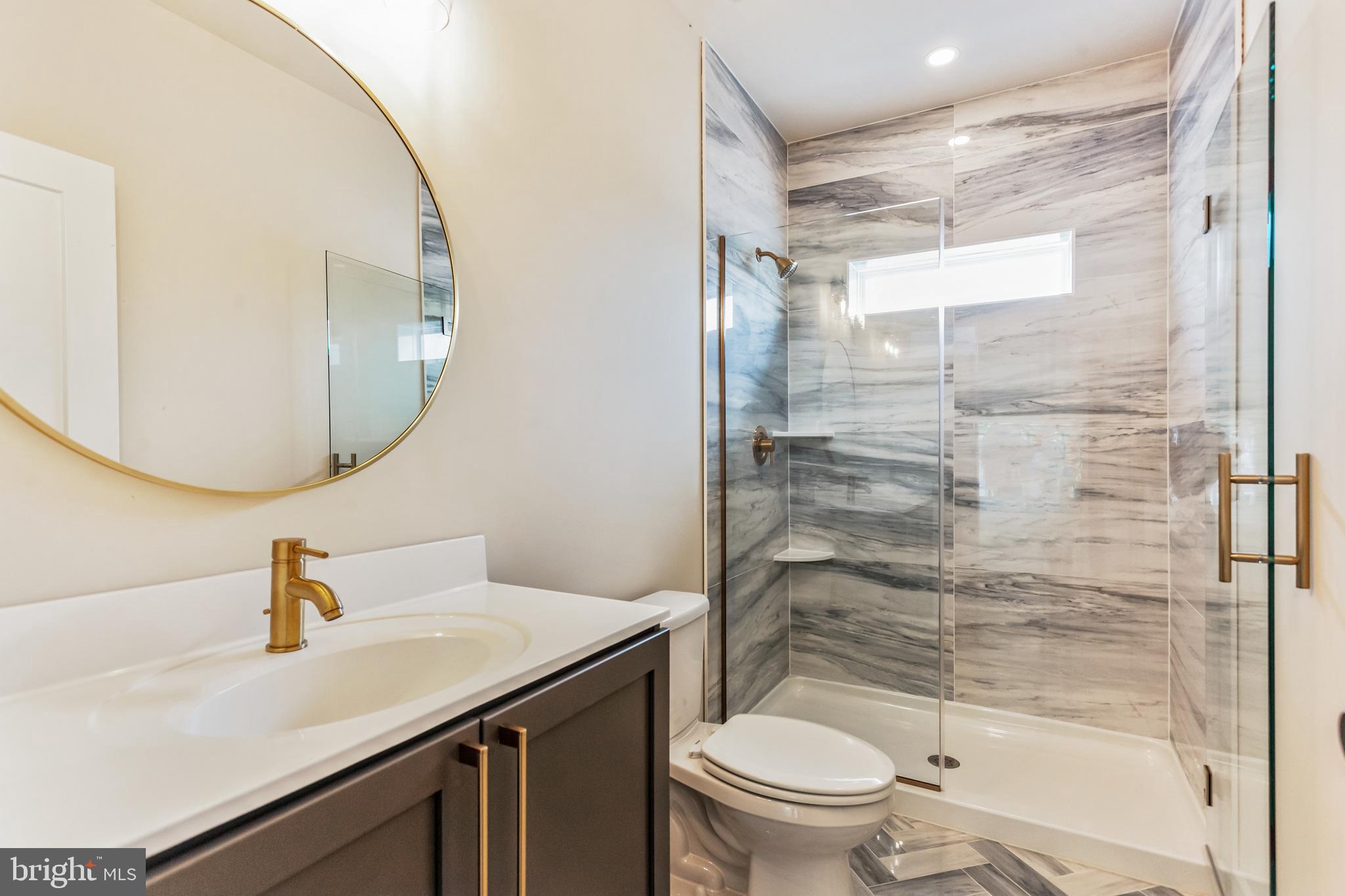 1236 Butler Pike, Unit 2 Conshohocken, PA 19428 - Photo 6 of 15 a bathroom with a sink toilet and shower