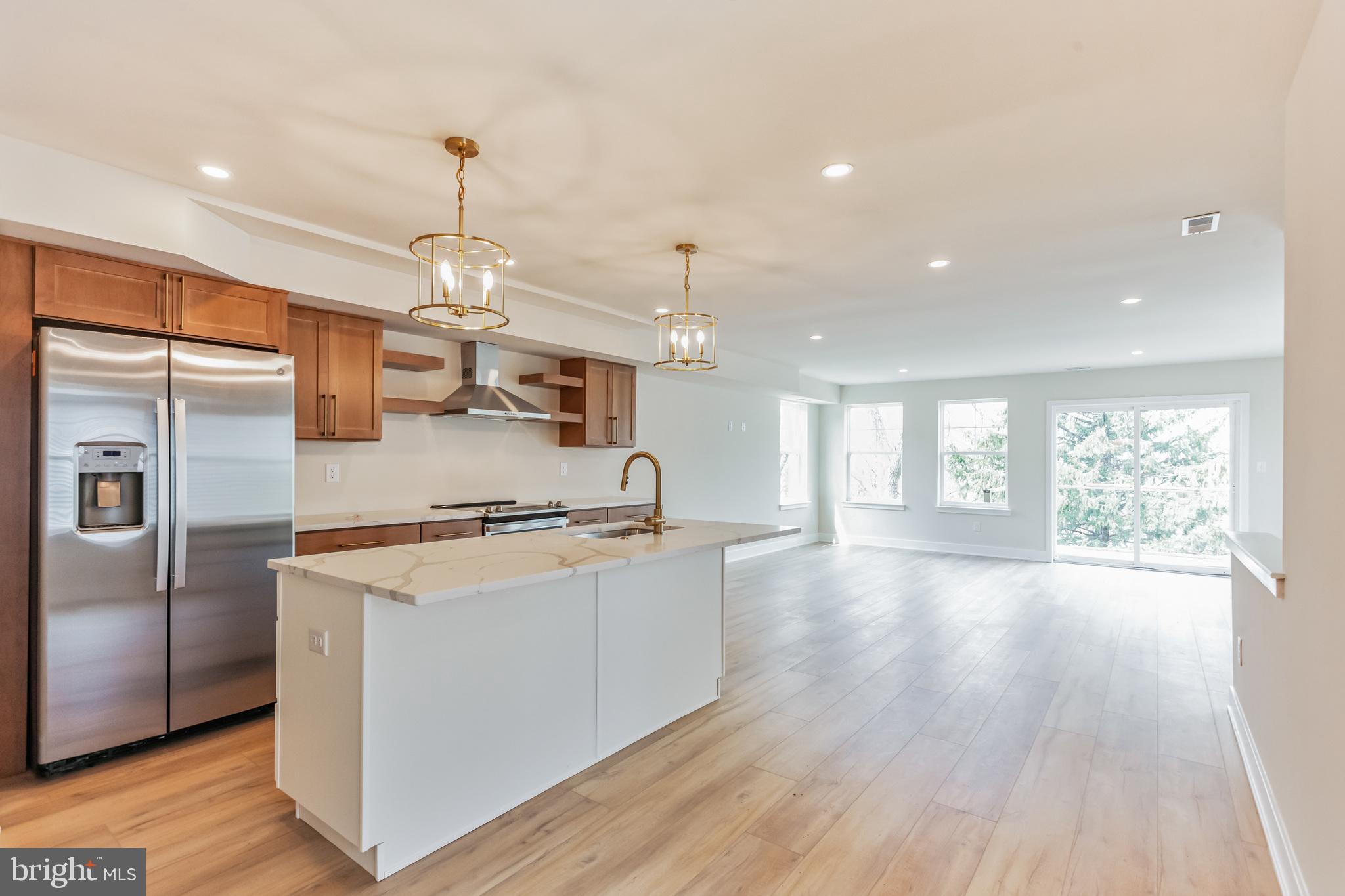1236 Butler Pike, Unit 2 Conshohocken, PA 19428 - Photo 9 of 15 a kitchen with stainless steel appliances granite countertop a stove and refrigerator
