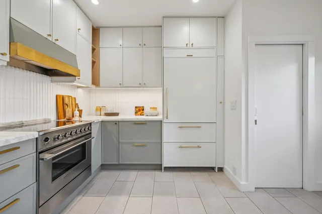 a kitchen with cabinets and appliances