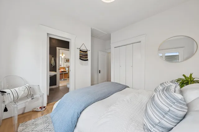 a bedroom with a bed and a couch