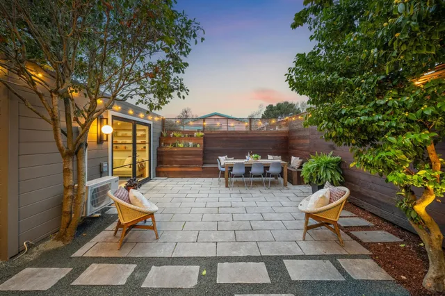 a chairs and a table in the patio