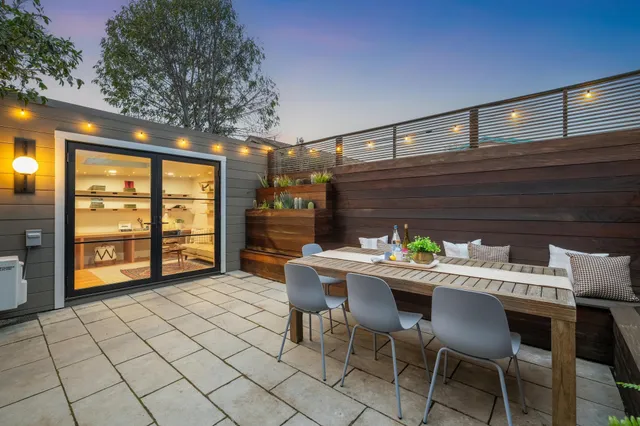 a view of a dining room with furniture and window