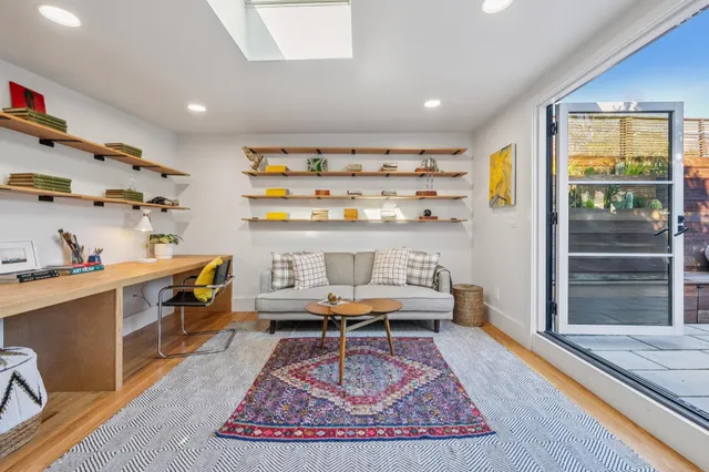 a living room with furniture and a rug