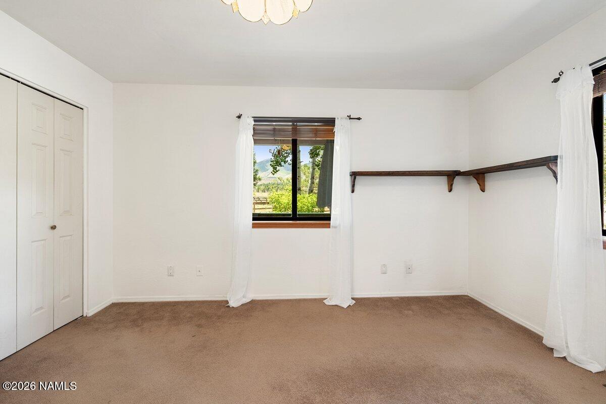 5535 East Western Star Road Flagstaff, AZ 86004 - Photo 17 of 49 an empty room with windows