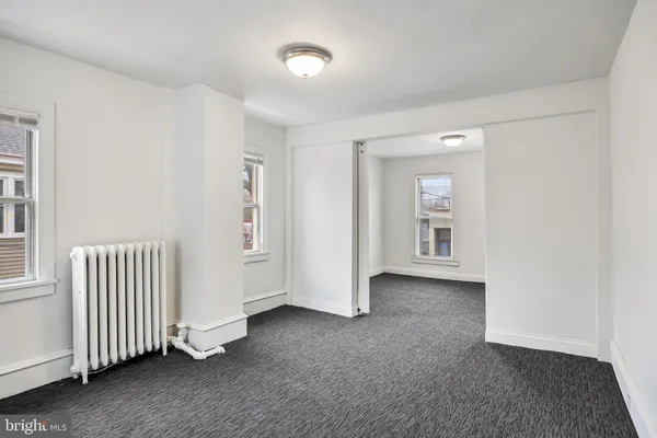 an empty room with windows