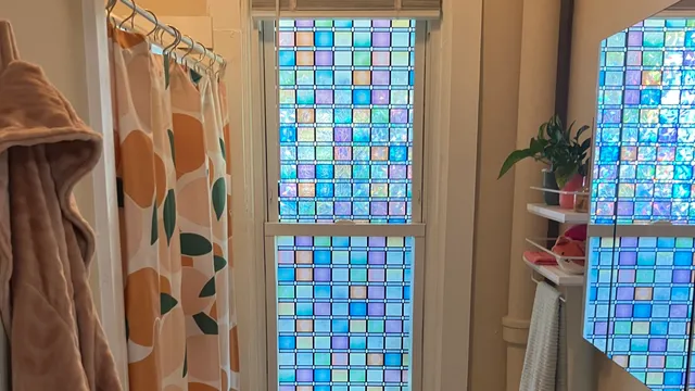 a kitchen with a stove a sink and a window