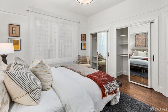 a bedroom with a bed and a view of bathroom