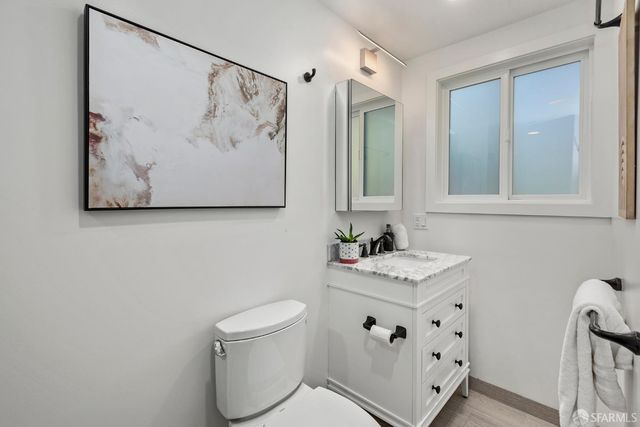 a bathroom with a toilet sink and tub