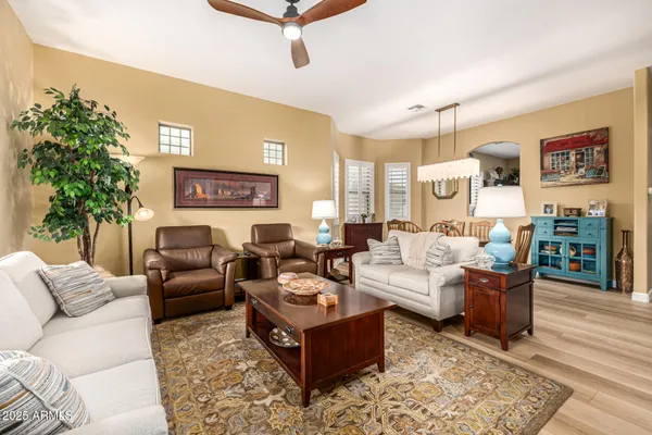 a view of a dining room with furniture and a large window