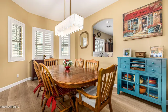 a dining room with furniture and window