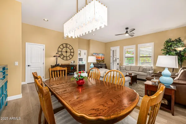 a view of staircase with railing and chandelier