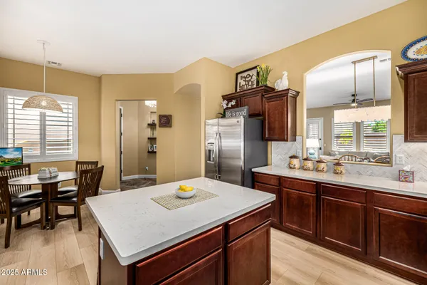 a kitchen with a stove a sink and a refrigerator