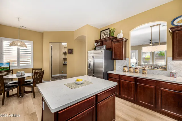 a kitchen with a stove a sink and a refrigerator