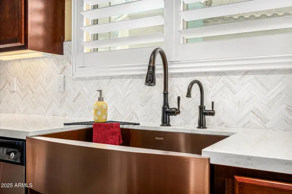 a stove top oven sitting inside of a kitchen