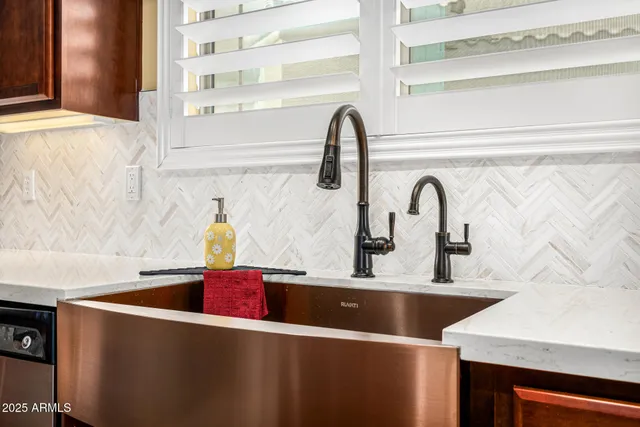 a stove top oven sitting inside of a kitchen