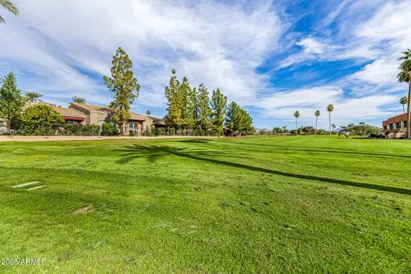a large kitchen with stainless steel appliances granite countertop a large stove top oven and a refrigerator