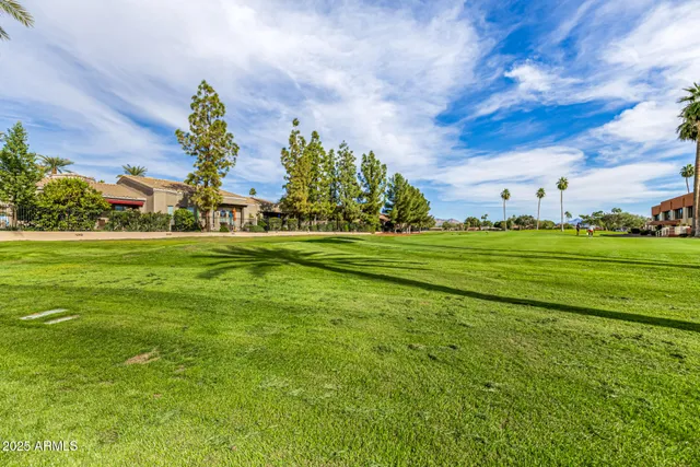 a large kitchen with stainless steel appliances granite countertop a large stove top oven and a refrigerator