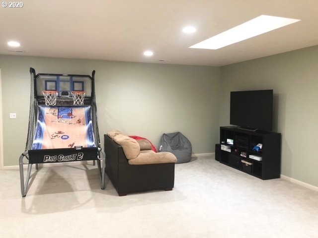 9245 Southwest Rambler Lane Portland, OR 97223 - Photo 13 of 19 a living room with furniture and a flat screen tv