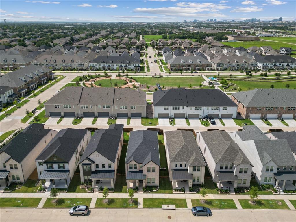 9533 Keep Street Frisco, TX 75035 - Photo 39 of 40 Aerial overview of a residential development featuring varied architectural styles and a central green space with walking paths