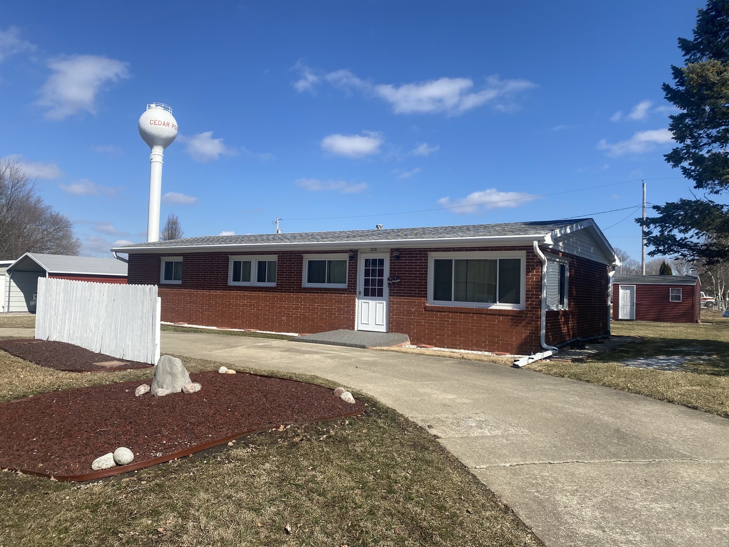 206 Maple Street Cedar Point, IL 61316 - Photo 1 of 15 a front view of a house with a yard