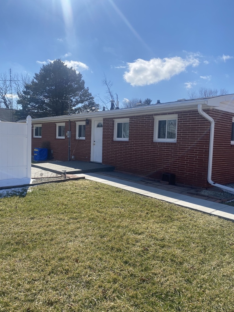 206 Maple Street Cedar Point, IL 61316 - Photo 2 of 15 a view of a backyard with a garden