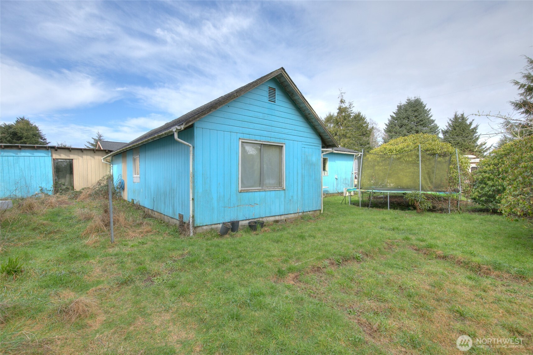 102 Elma Street Copalis Beach, WA 98535 - Photo 3 of 23 a view of an house with backyard space and garden