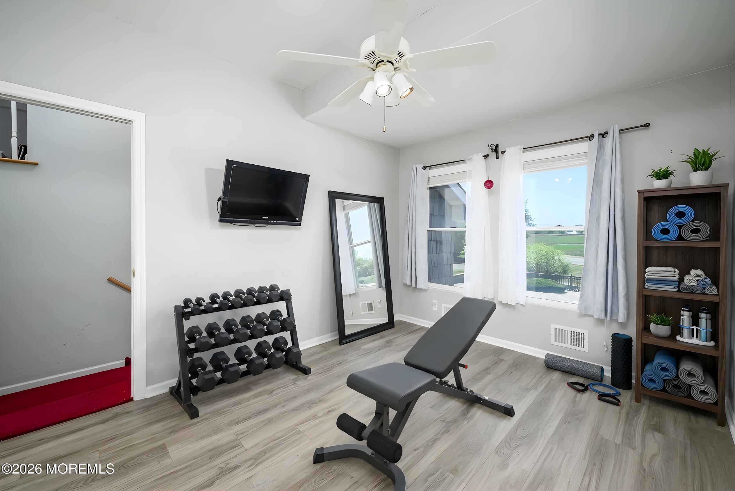 805 Front Street Union Beach, NJ 07735 - Photo 26 of 65 a living room with furniture and a flat screen tv