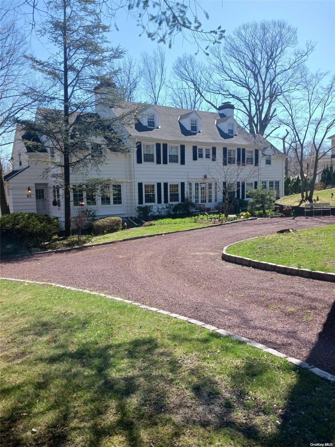 91 Station Road Great Neck, NY 11023 - Photo 1 of 1 a view of a house with a yard