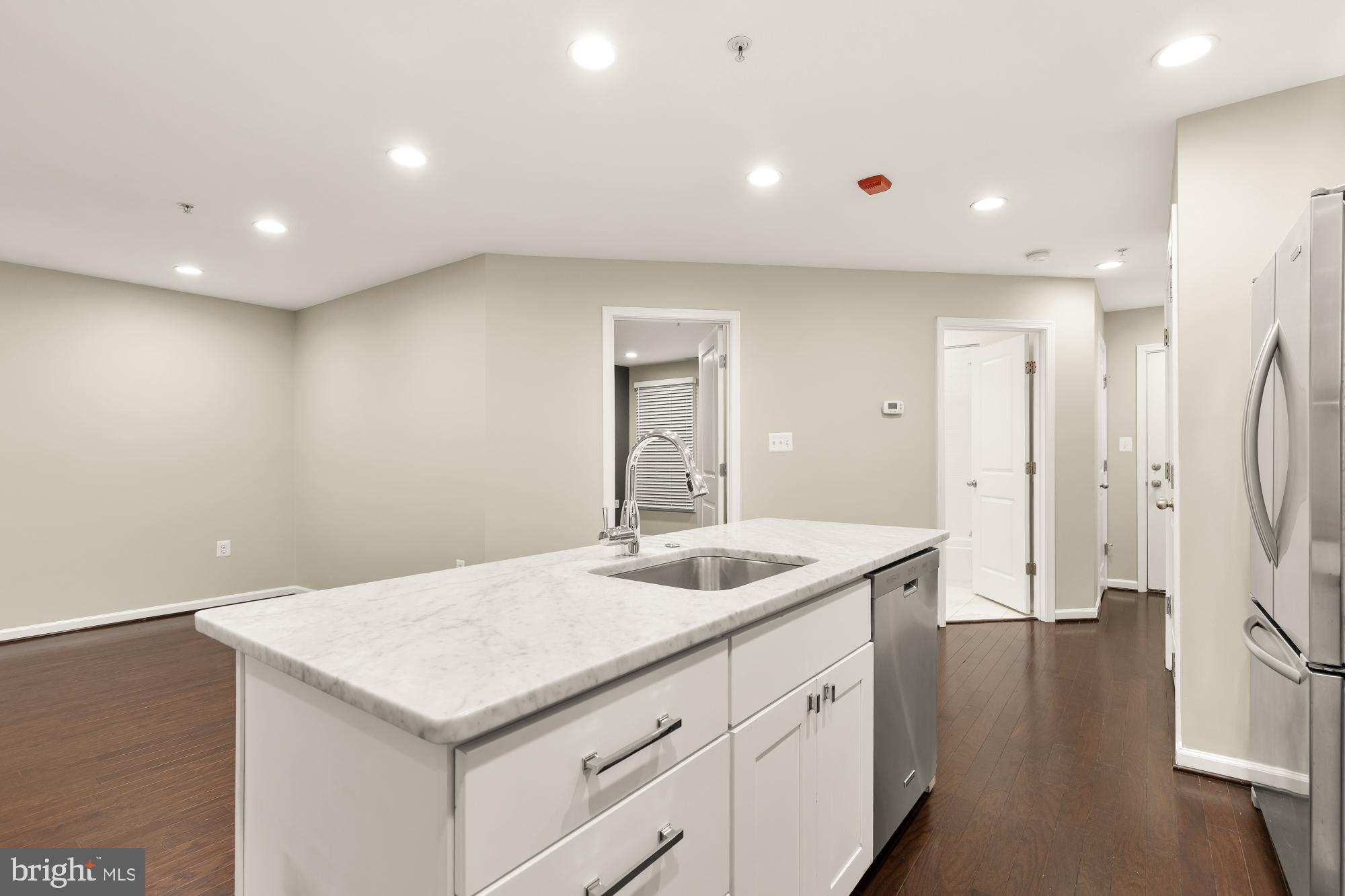 1845 Kalorama Road Northwest, Unit 1 Washington, DC 20009 - Photo 11 of 39 a kitchen with a sink and refrigerator