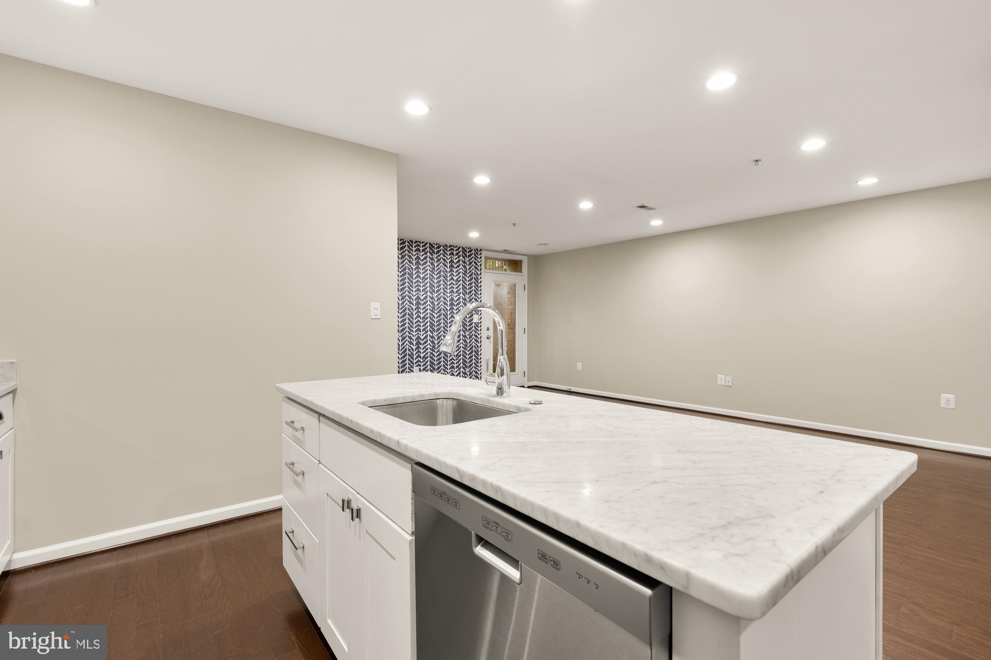 1845 Kalorama Road Northwest, Unit 1 Washington, DC 20009 - Photo 14 of 39 a kitchen with a sink and cabinets