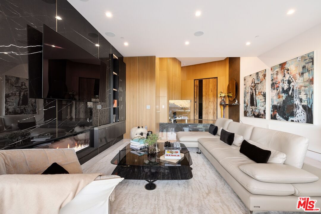 976 Bel Air Road Los Angeles, CA 90077 - Photo 2 of 23 a living room with furniture and a large window