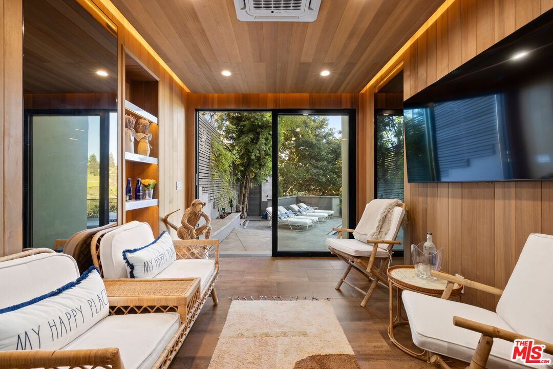 976 Bel Air Road Los Angeles, CA 90077 - Photo 21 of 23 a outdoor space with furniture and large window