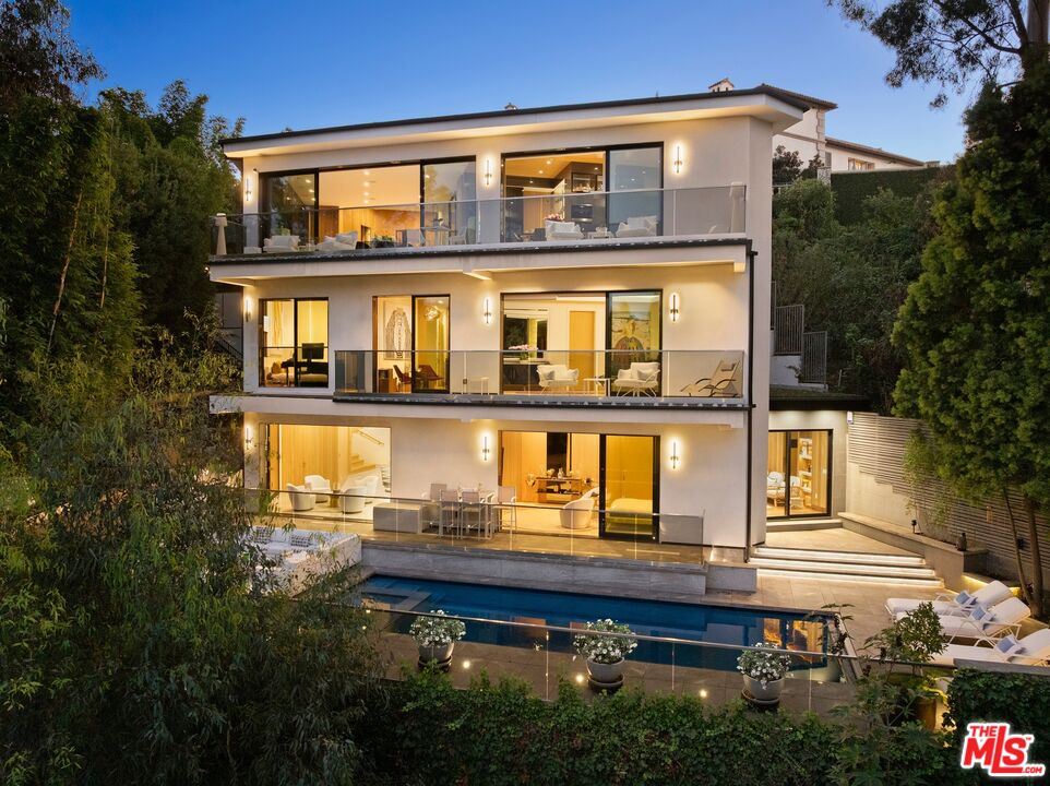 976 Bel Air Road Los Angeles, CA 90077 - Photo 23 of 23 a front view of a house with a yard