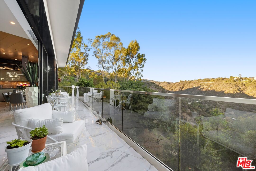 976 Bel Air Road Los Angeles, CA 90077 - Photo 4 of 23 a view of a balcony with mountain view