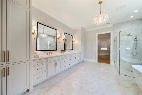 a spacious bathroom with a double vanity sink and a mirror