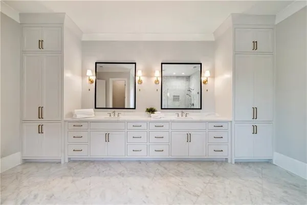 a spacious bathroom with a sink and a mirror