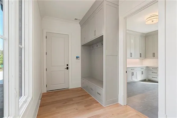 a view of a bathroom with a glass door and a bathroom