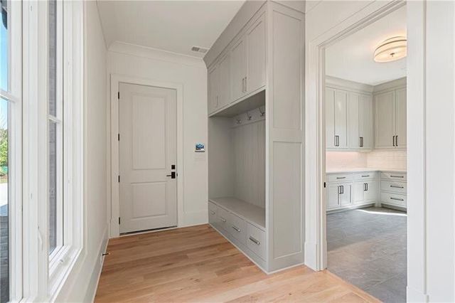 a view of a bathroom with a glass door and a bathroom