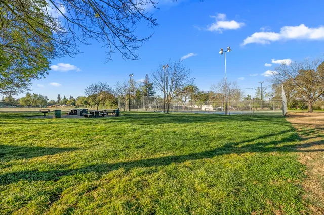 a view of a golf course with a lake
