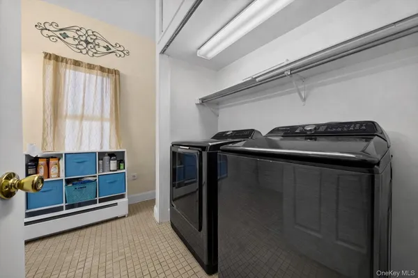 a view of a bedroom with wooden floor and a window