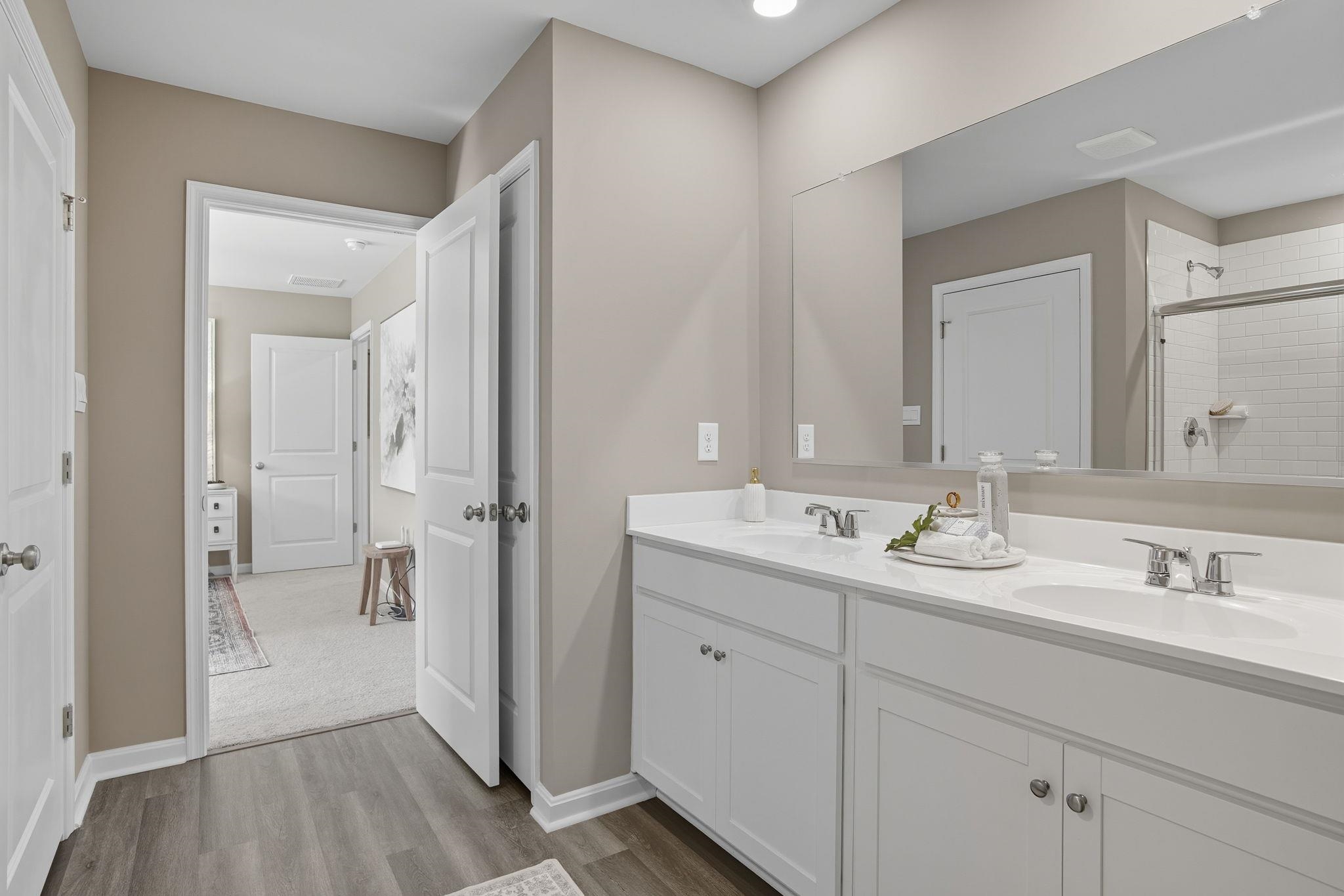 113 Meadow Ridge Way Staunton, VA 24401 - Photo 25 of 30 a en suite bathroom with a sink mirror and shower
