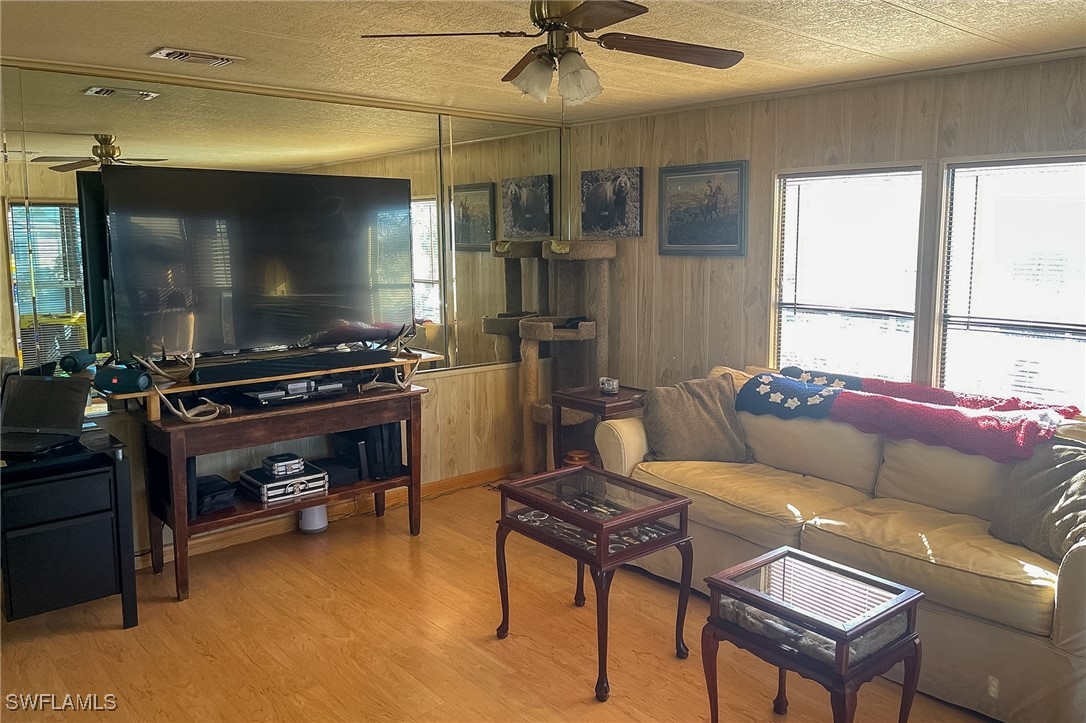 22 Ashe Alva, FL 33920 - Photo 11 of 42 a living room with furniture and a flat screen tv