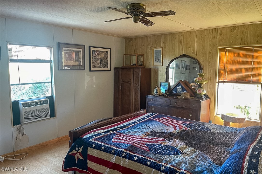 22 Ashe Alva, FL 33920 - Photo 14 of 42 a bed room with a bed mirror and a window